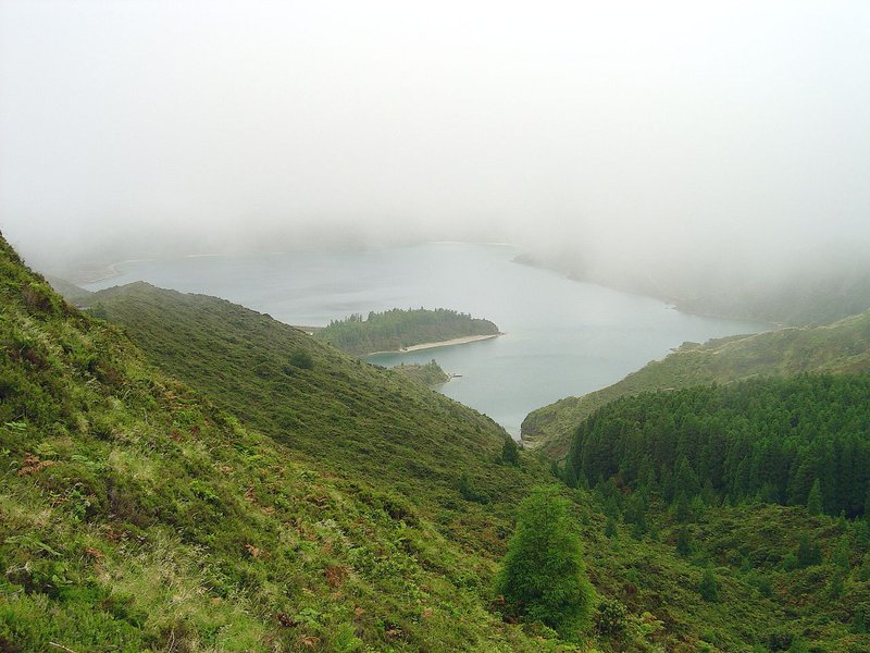 Lagoa do Fogo volcanic crater lake surrounded by green ridges