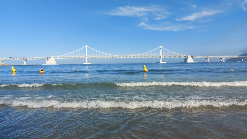 Gwangalli Beach with the Gwangan Bridge spanning the bay behind the café-lined seafront