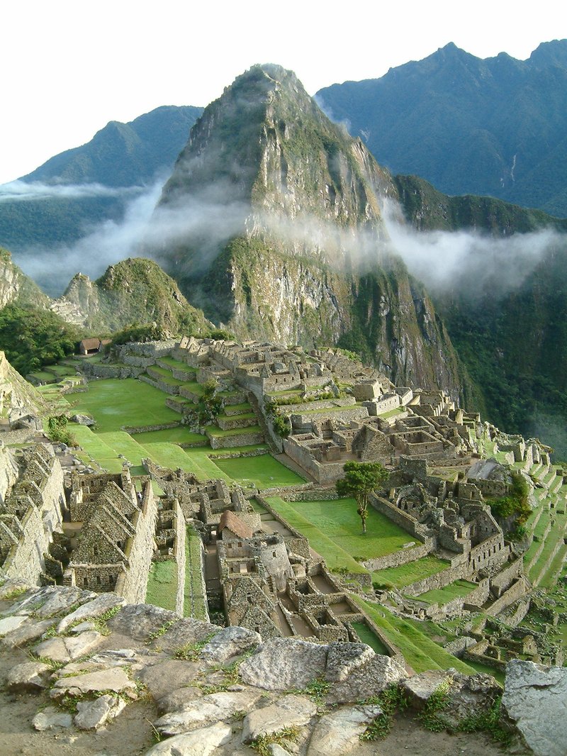 Huayna Picchu peak rising above Machu Picchu citadel at sunrise