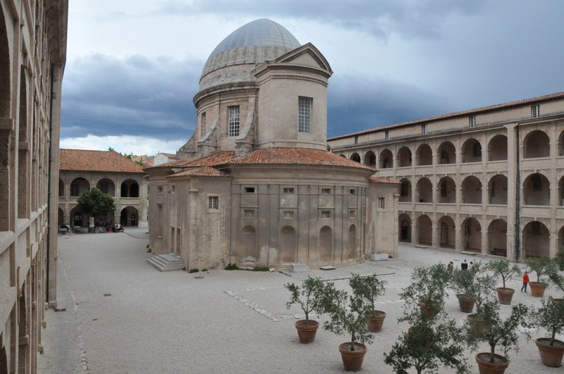 Arcaded courtyard of the Vieille Charité with oval Baroque chapel
