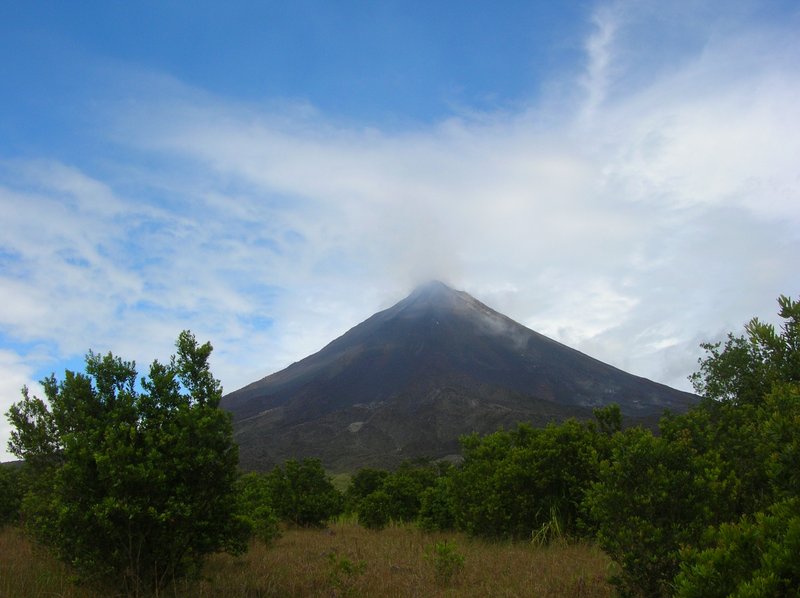 Arenal Volcano rising above the rainforest canopy
