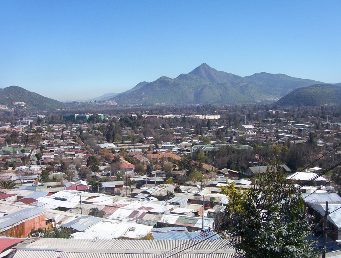 Cerro Manquehue — summit ridge rising above Santiago with Andes backdrop