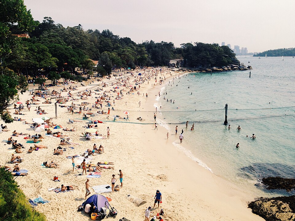 Nielsen Park harbour beach and CBD skyline across the water