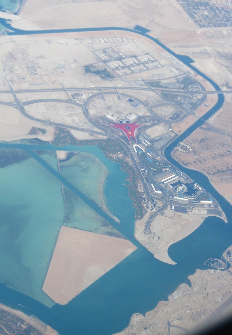 Aerial view of the red-roofed Ferrari World building on Yas Island, Abu Dhabi