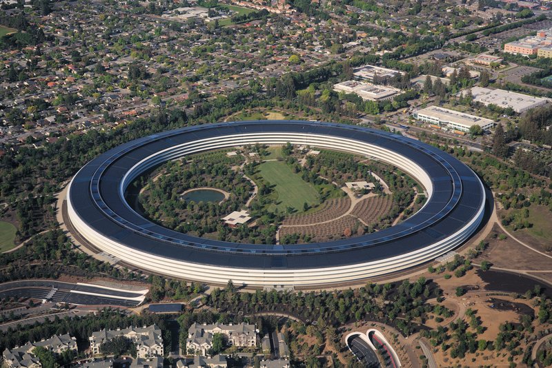 Aerial view of Apple Park's ring-shaped main building set within landscaped grounds, Cupertino