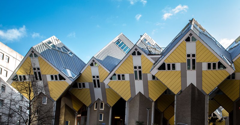 Rotterdam's yellow Cube Houses tilted at 45 degrees above the Blaak square