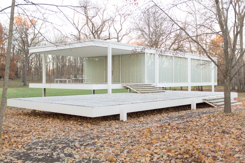Mies van der Rohe's steel-and-glass Farnsworth House raised above its wooded floodplain site