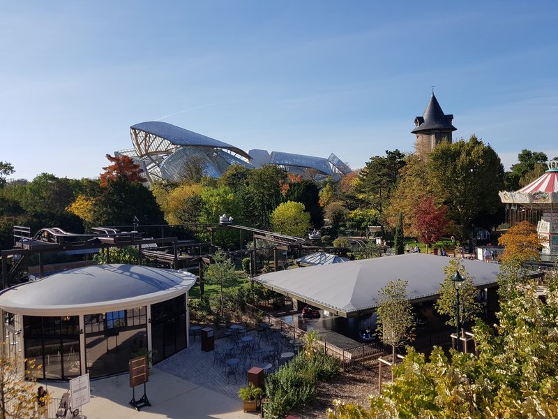 Fondation Louis Vuitton's glass sails rising above the Bois de Boulogne