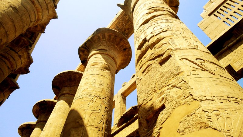 Massive carved papyrus columns in the Great Hypostyle Hall at Karnak