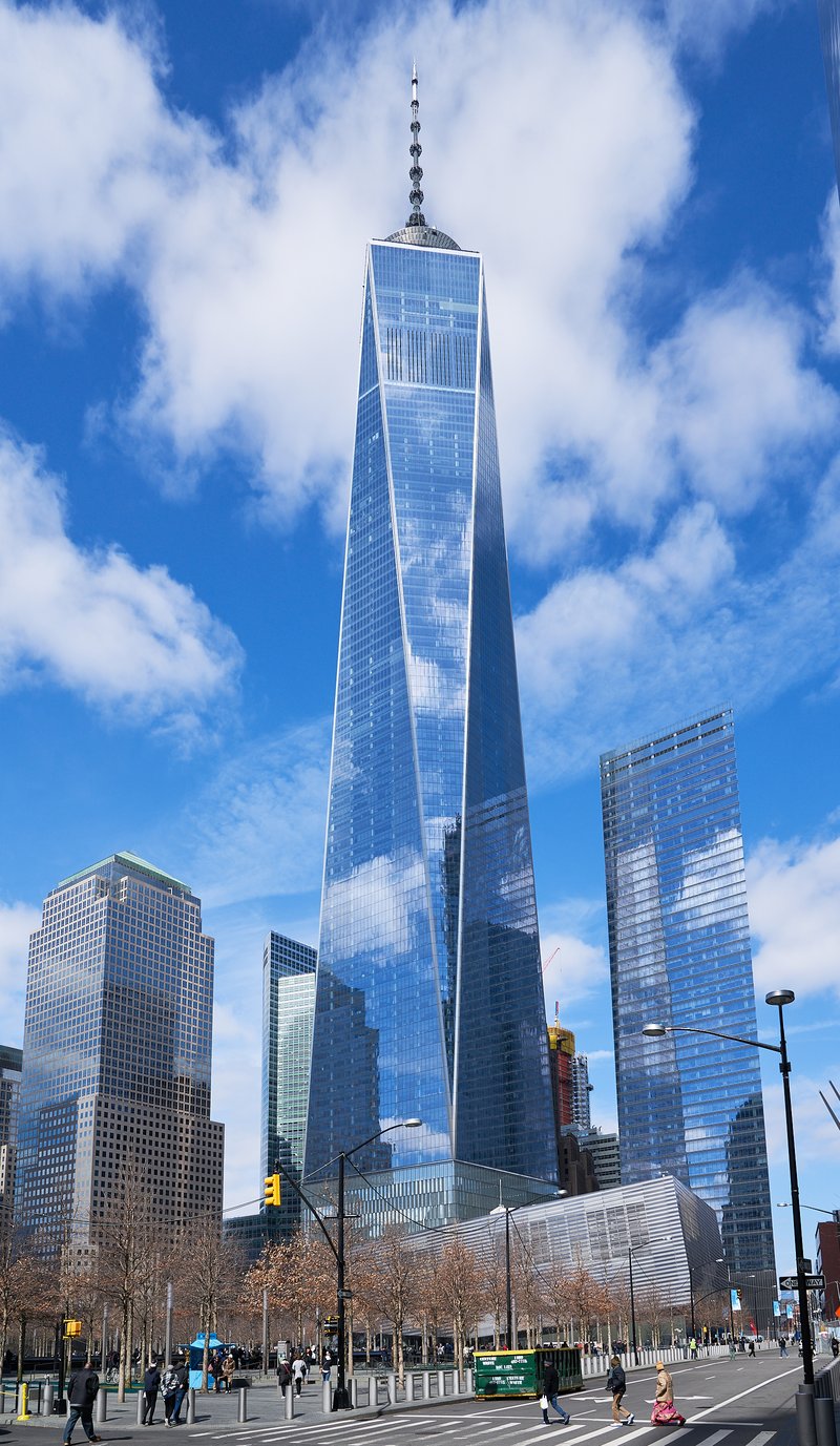 One World Trade Center tapering from its square base to its antenna spire against the Manhattan skyline