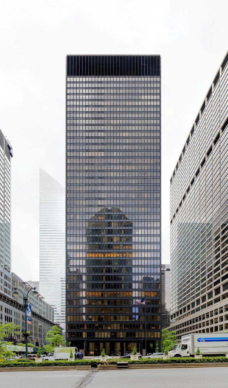 Mies van der Rohe's bronze-and-glass Seagram Building tower set back on Park Avenue