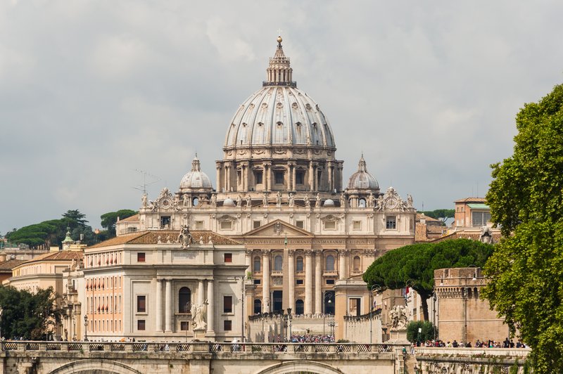 St. Peter's Basilica's facade and Michelangelo's dome rising over Vatican City