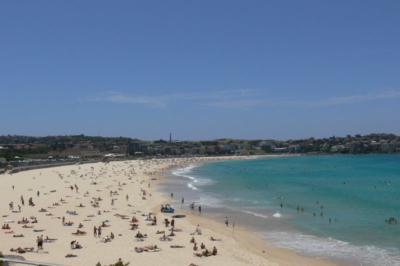 Wide aerial view of Bondi Beach's curved sand and promenade in Sydney's eastern suburbs