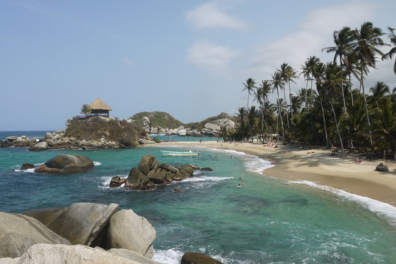 Cabo San Juan del Guía cove in Tayrona National Park, boulders and palms framing the beach