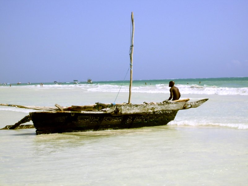 White coral sand and reef-calmed water at Diani Beach, Kenya