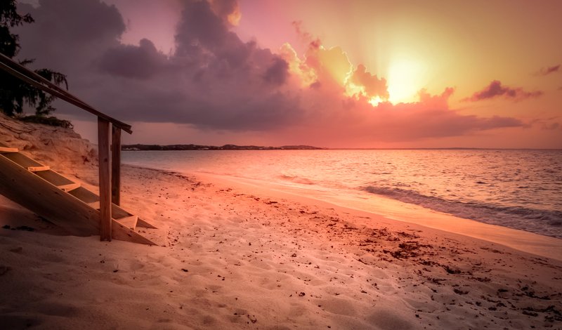 Sunset over Grace Bay's white sand and calm water, Providenciales, Turks and Caicos