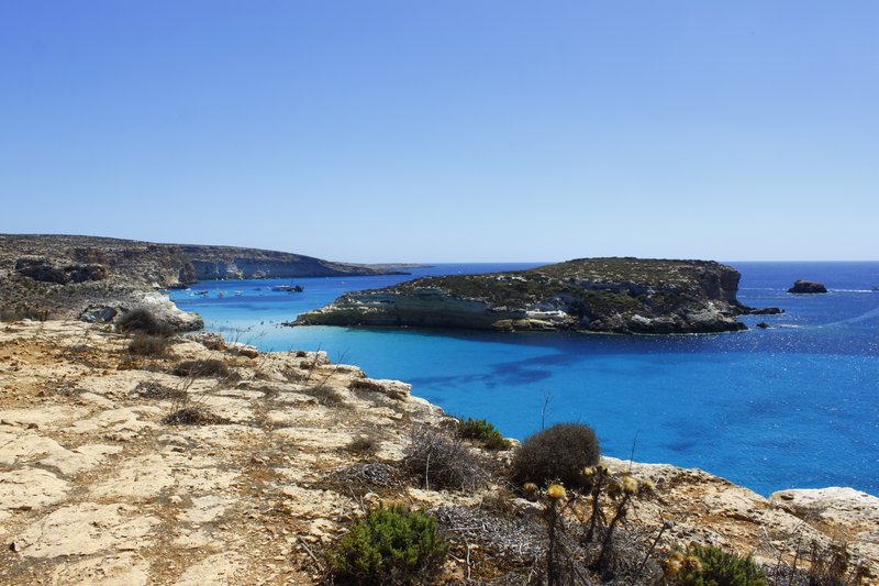 Rabbit Beach's sand and turquoise water facing the offshore islet, Lampedusa
