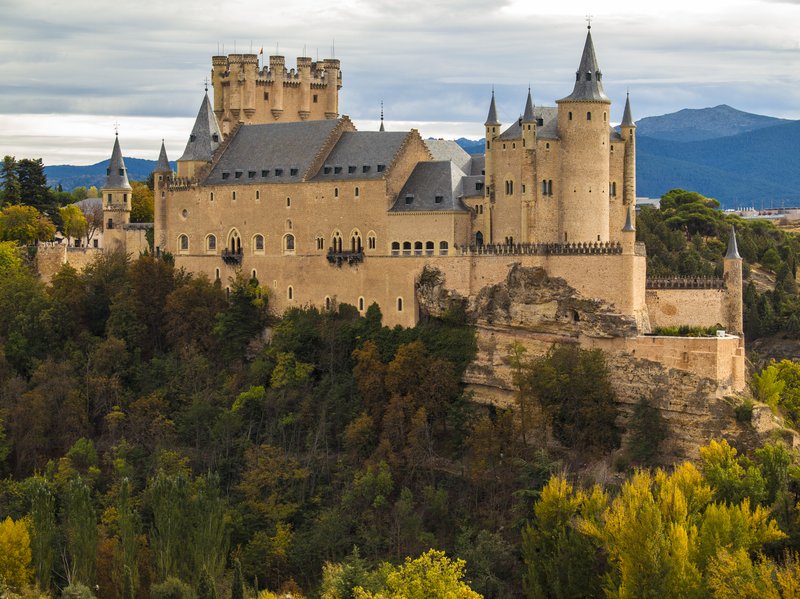 Ship-shaped Alcázar of Segovia rising above the river confluence