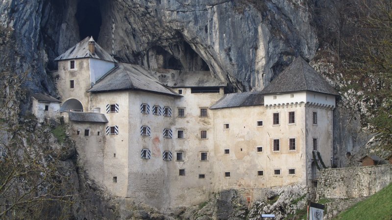Predjama Castle built into the mouth of a cliff cave
