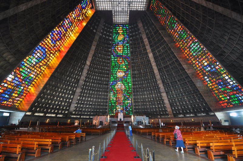 Interior of the Metropolitan Cathedral of Rio de Janeiro, its four stained-glass strips rising to the apex