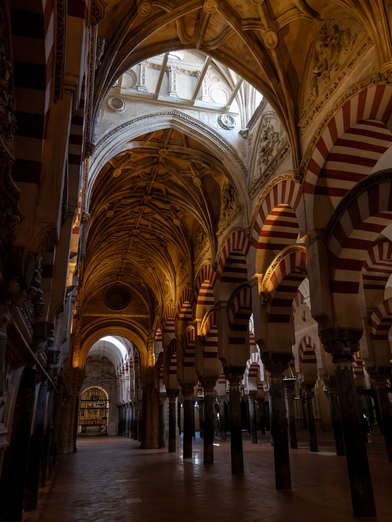 Red-and-white striped double arches inside the Mezquita of Córdoba