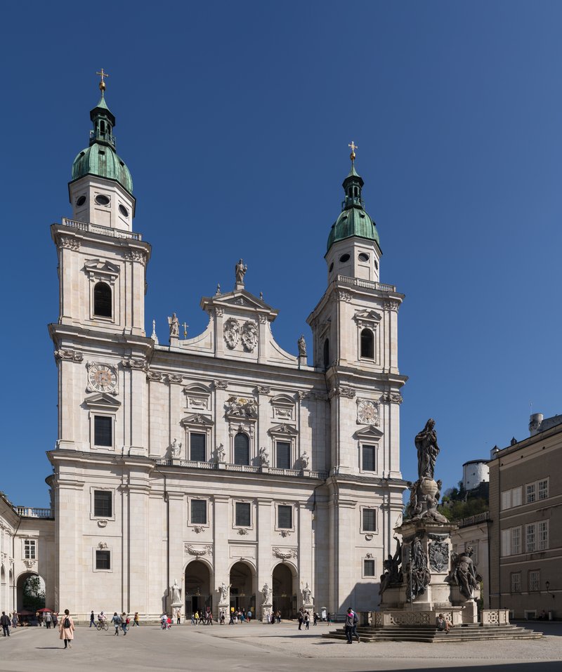 Salzburg Cathedral's Baroque facade with twin green-domed bell towers