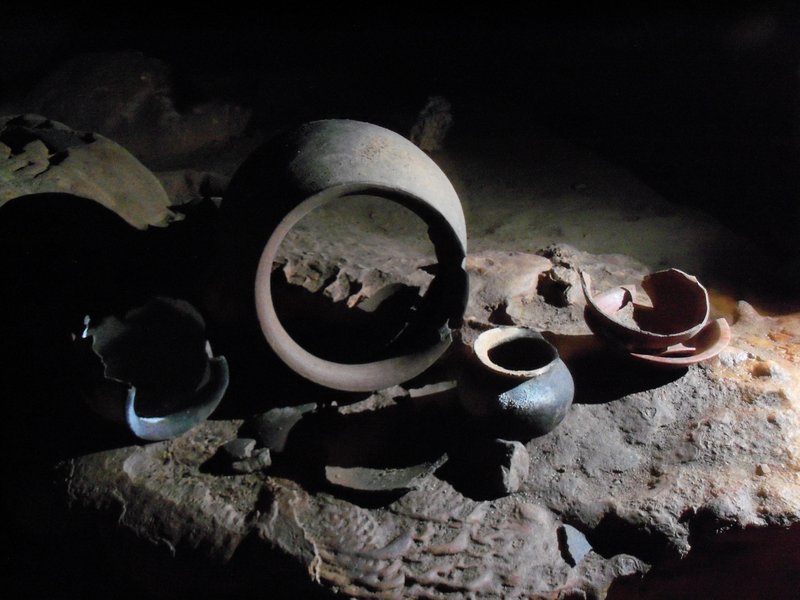 Ancient Maya pottery vessels inside Actun Tunichil Muknal cave