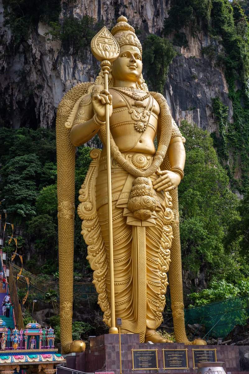 Golden Lord Murugan statue and staircase at Batu Caves