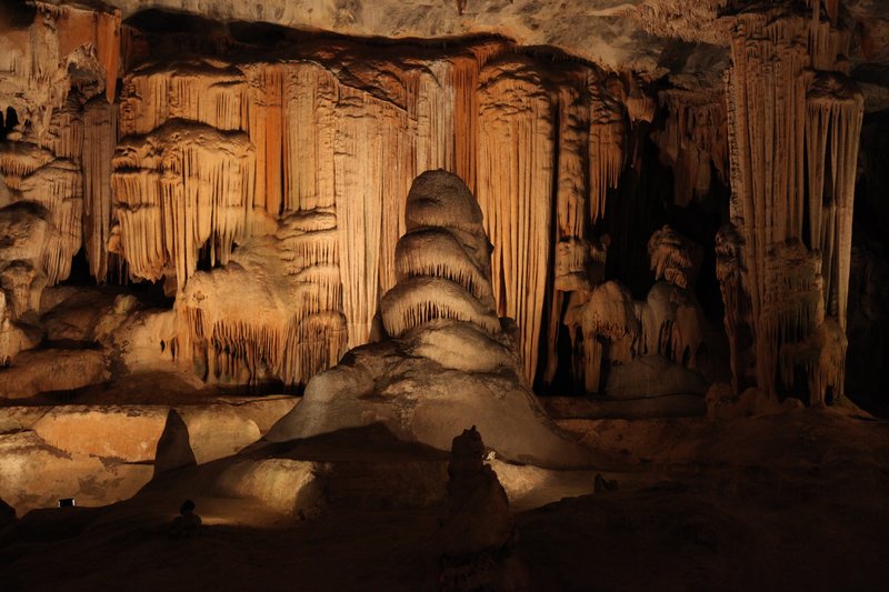 Large dripstone chamber with stalactite and stalagmite formations inside Cango Caves, South Africa