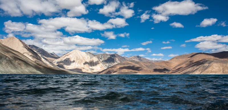 Pangong Lake in Ladakh, its intensely blue water set against bare brown mountains