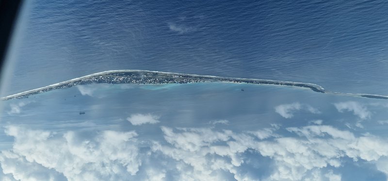 Aerial view of Funafuti Atoll's narrow coral islets surrounding a central lagoon, Tuvalu