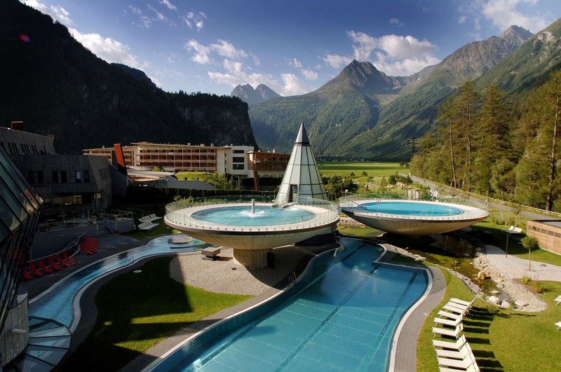 Aqua Dome's elevated saucer-shaped outdoor pools framed by the Tyrolean Alps