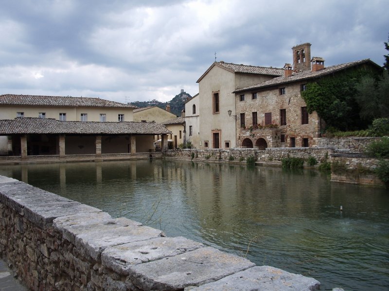 Bagno Vignoni's central piazza occupied by a large stone thermal pool, Val d'Orcia