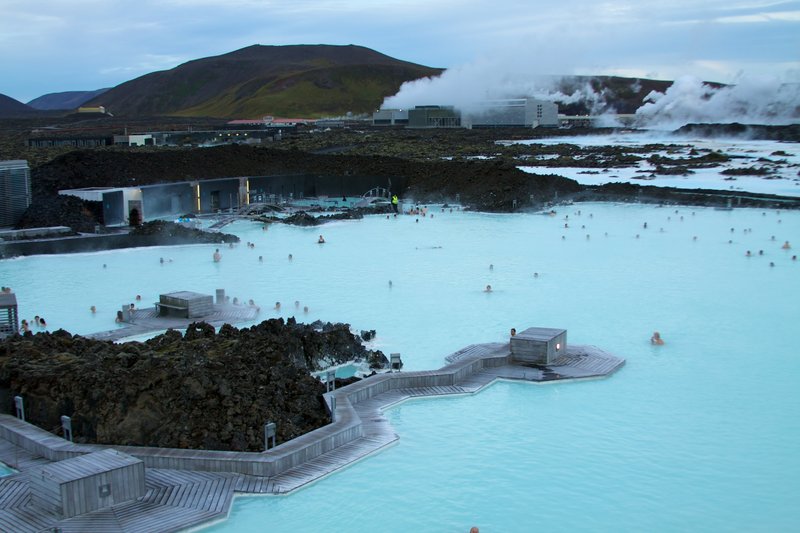 Milky-blue silica waters of the Blue Lagoon with the geothermal power plant behind