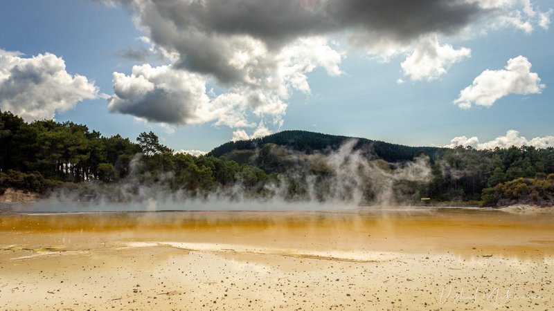 The turquoise and orange-rimmed Champagne Pool at Wai-O-Tapu geothermal park