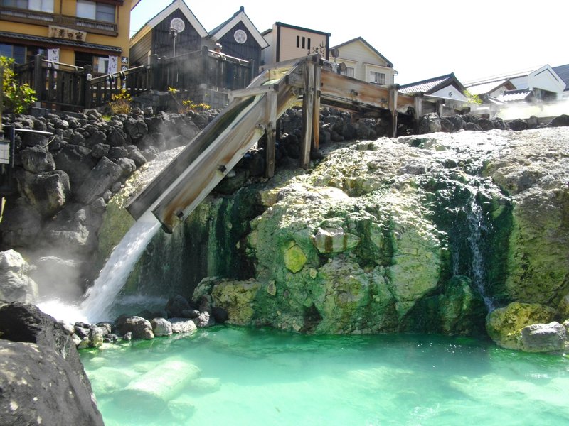 Yubatake hot spring field with wooden cooling troughs, Kusatsu Onsen, Japan