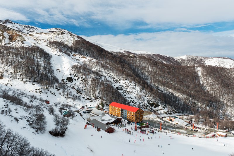 Snow-covered ski slopes and lodge at Termas de Chillán