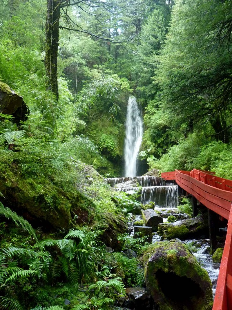 Slate pools and red wooden walkways at Termas Geométricas, Coñaripe