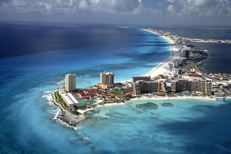 Aerial view of Cancun hotel zone with turquoise Caribbean waters and white sand beach