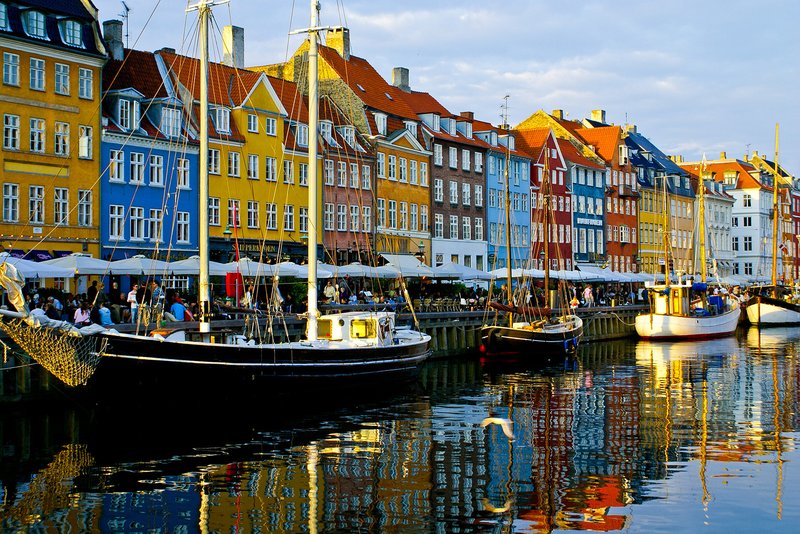 Colorful Nyhavn canal waterfront in Copenhagen with historic townhouses