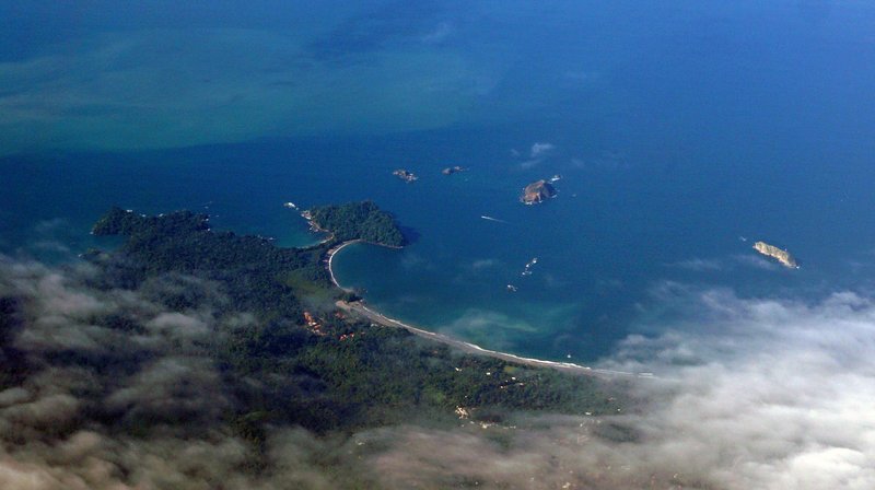 Aerial view of Manuel Antonio National Park coastline with beach and rainforest