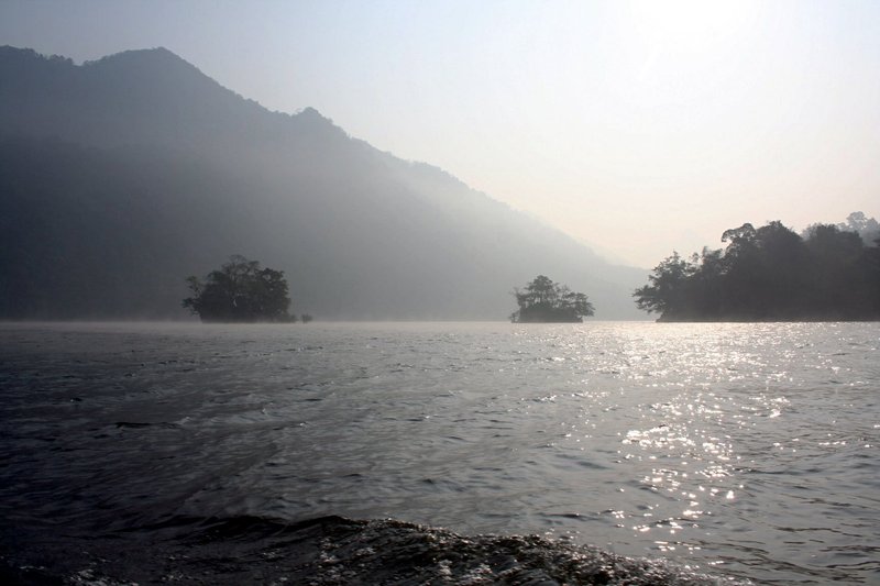 Morning mist over Ba Bể Lake, Vietnam