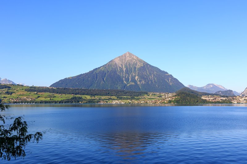 Lake Thun with the Niesen pyramid peak above Merligen