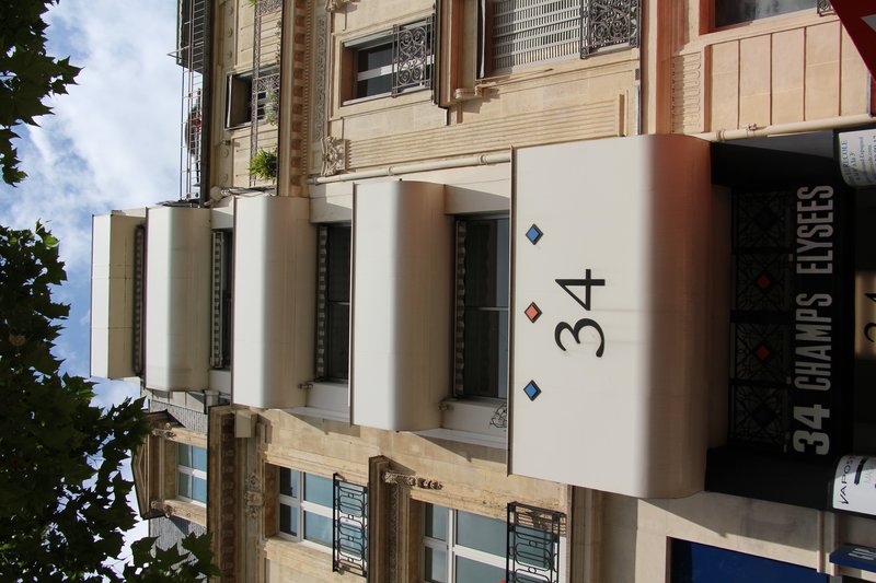 Haussmann-era Art Deco building on Avenue des Champs-Élysées, Paris
