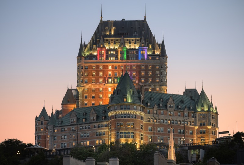 Fairmont Le Château Frontenac illuminated at night above Quebec City