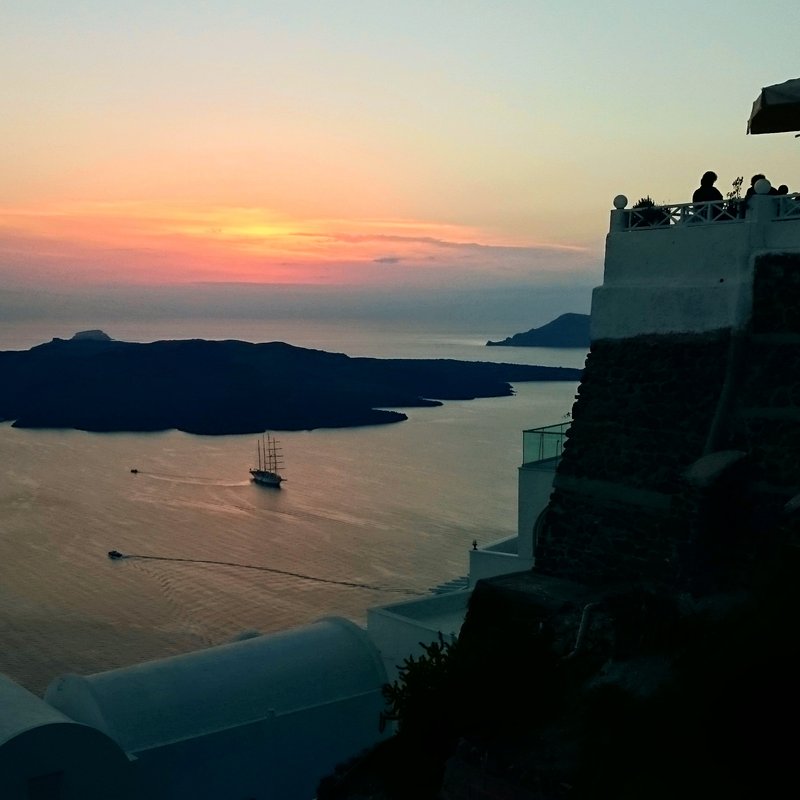 View across the Santorini caldera at sunset from Imerovigli, Cyclades, Greece