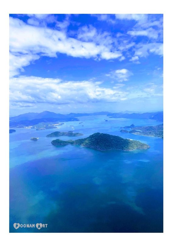 Aerial view of Langkawi's forested islands and turquoise Andaman Sea, Malaysia
