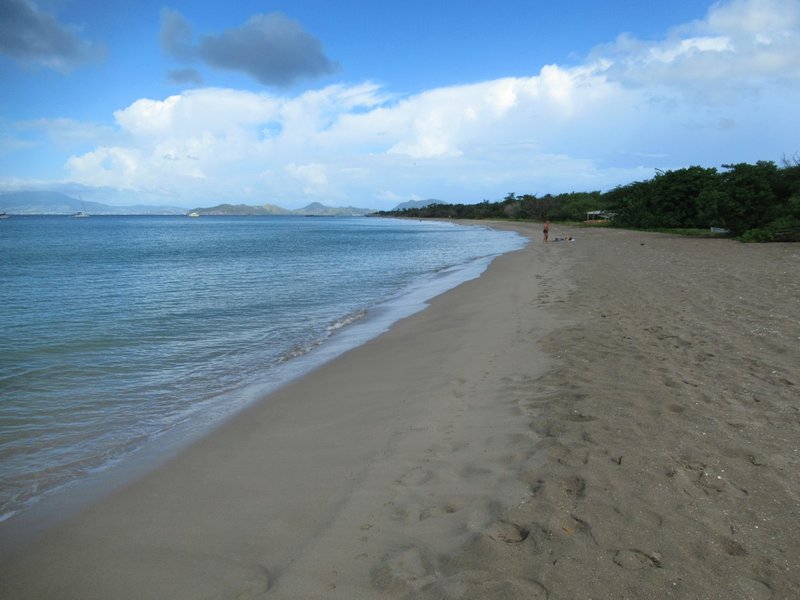 Pinney's Beach on the west coast of Nevis, with Nevis Peak rising in the distance