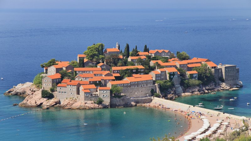 Sveti Stefan island-village connected to the Montenegrin coast by a narrow causeway