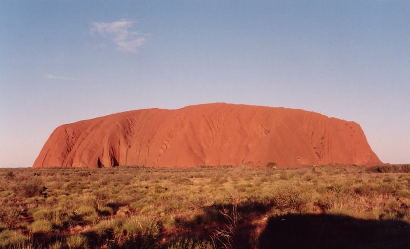 Uluru (Ayers Rock) rising from the red desert, Kata Tjuta National Park, Northern Territory
